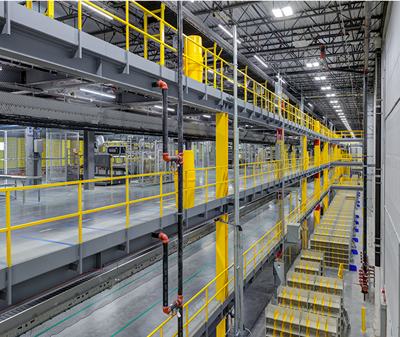 Interior view of the Project Tropical Automated Robotics Fulfillment Center showing multiple levels