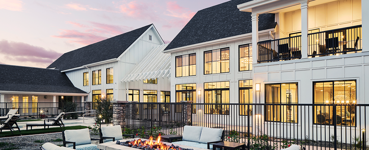 Exterior view of outdoor lounge areas at the American Groves Senior Living Center