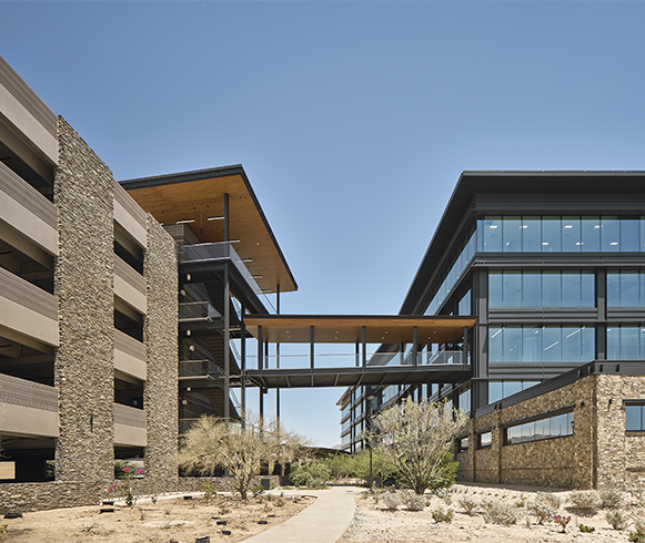 Exterior view of walkway connecting parking to main building at Cavasson East