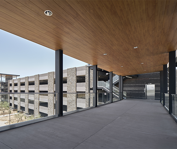 Exterior view of walkway that connects parking garage to main building at Cavasson East