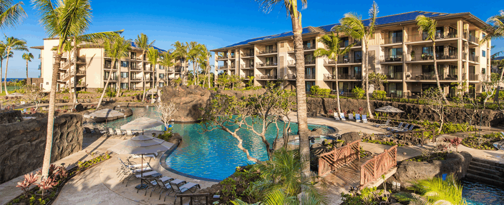 Exterior view of pool with walkway bridging over it at Koloa Landing at Poipu