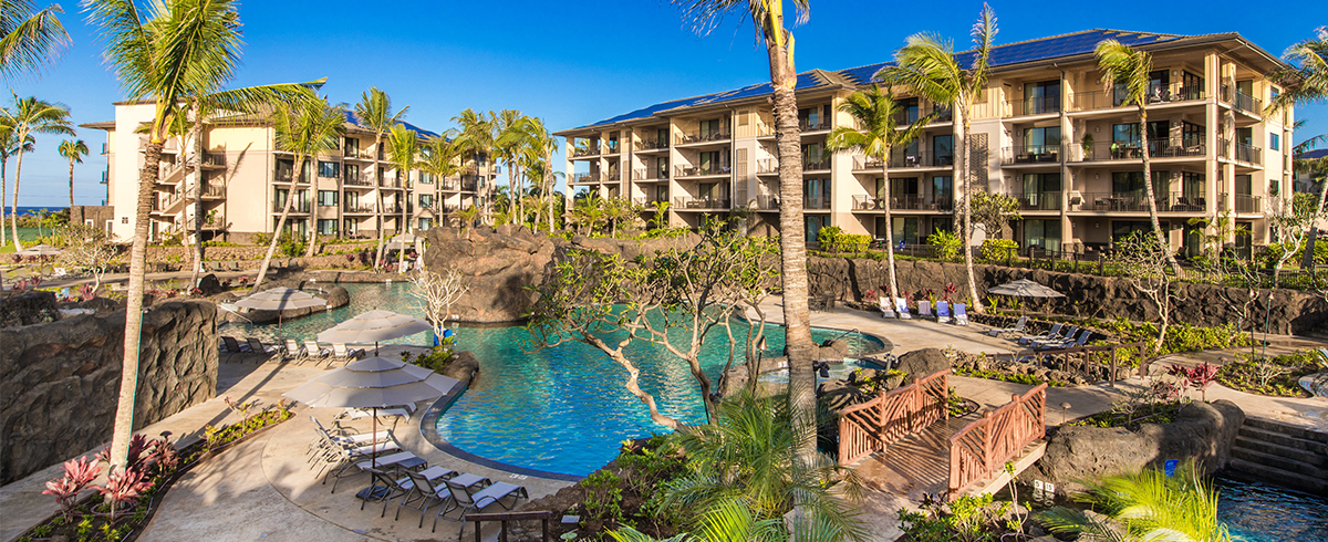 Exterior view of pool with walkway bridging over it at Koloa Landing at Poipu