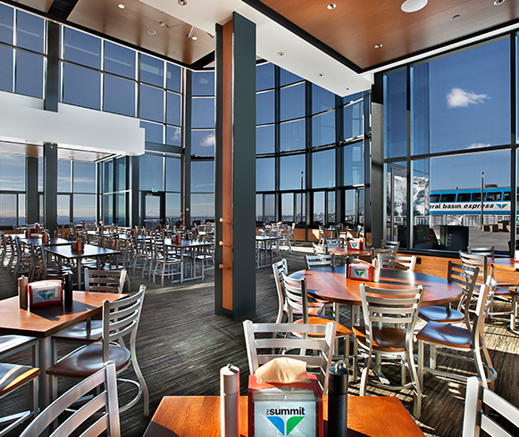 Interior view of dining tables inside the Hidden Peaks on the Summit, Snowbird Resort