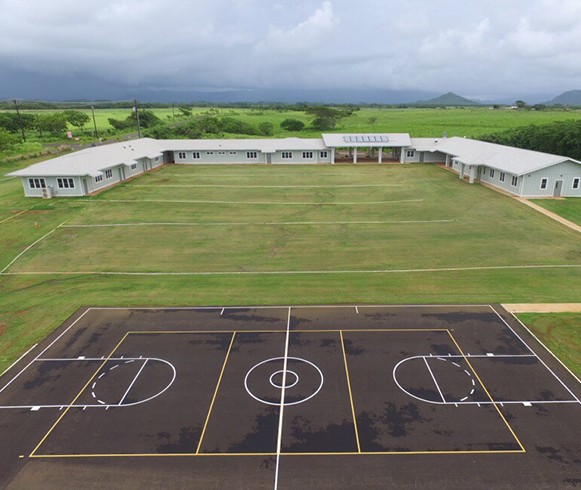 Exterior drone view of basketball court at the Adolescent Treatment & Healing Center