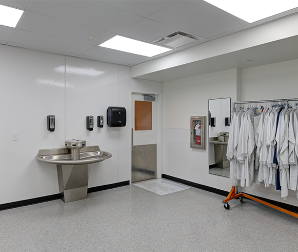 Lab coats and wash area for Ultradent lab employees
