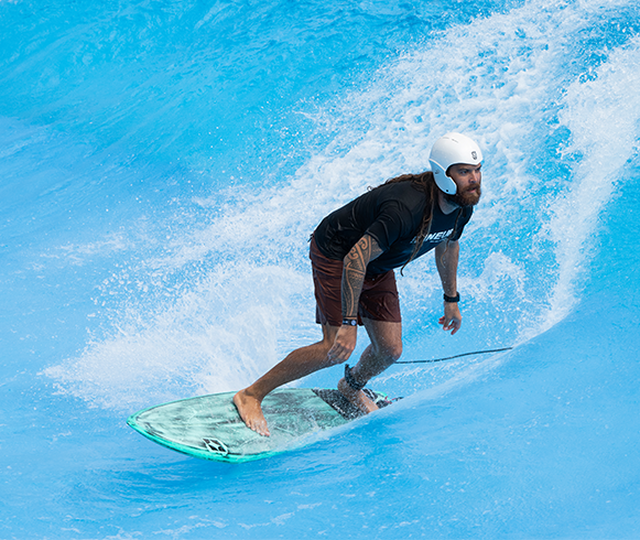 Man surfboarding at WaiKai Waterfront