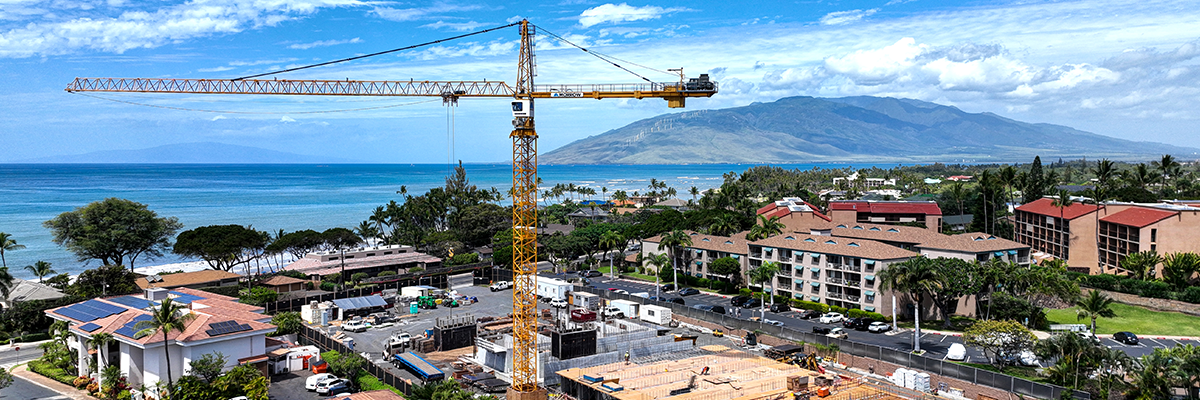 View of tropical area in the Pacific showing construction crane and construction site