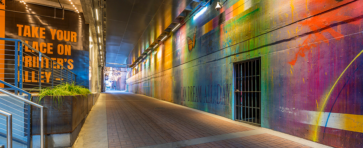 Exterior view at One Nashville showing bright spray painted walls.