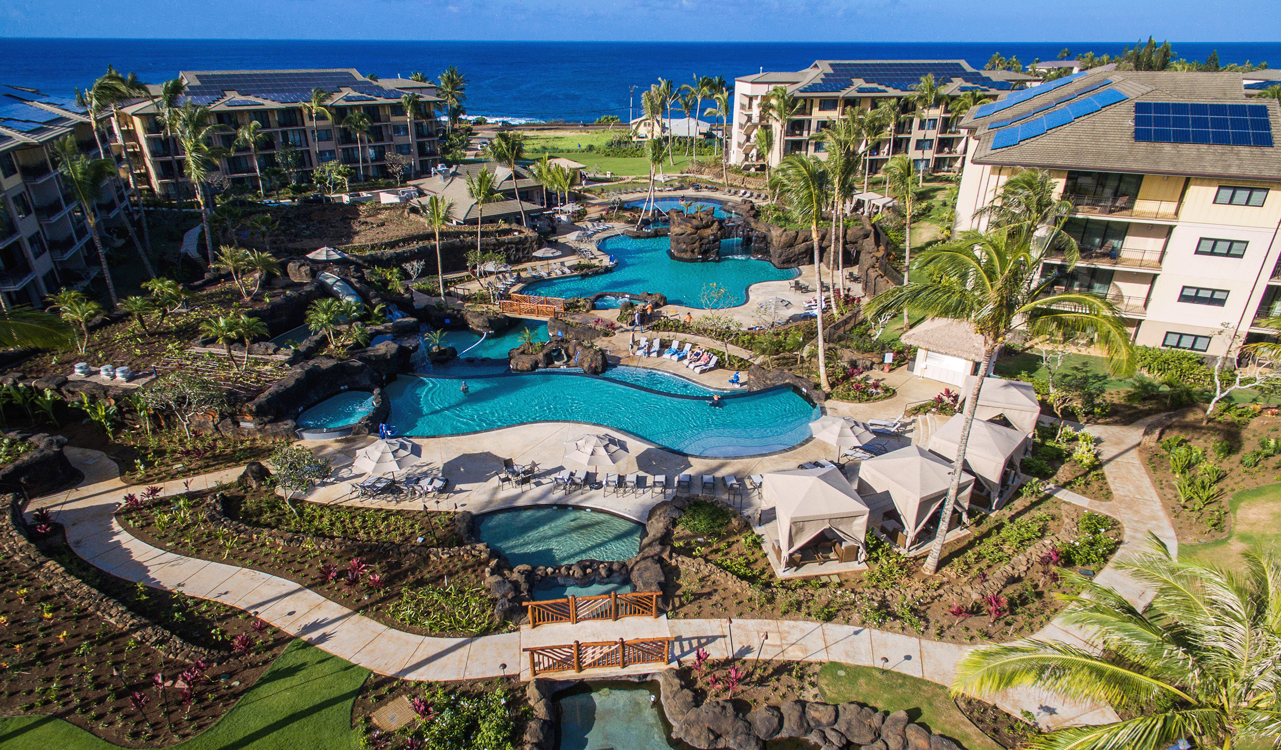 Drone view of multiple pools and lounge areas at the Koloa Landing