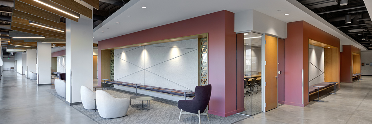 Interior photo of an office space with open seating throughout a hallway.