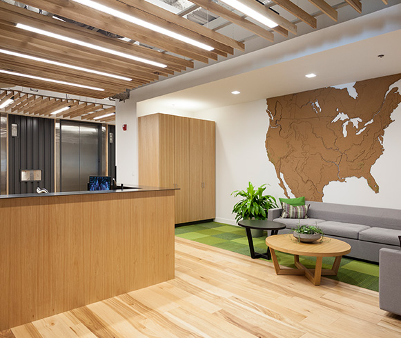 A feature wall that includes a wooden map of North America.