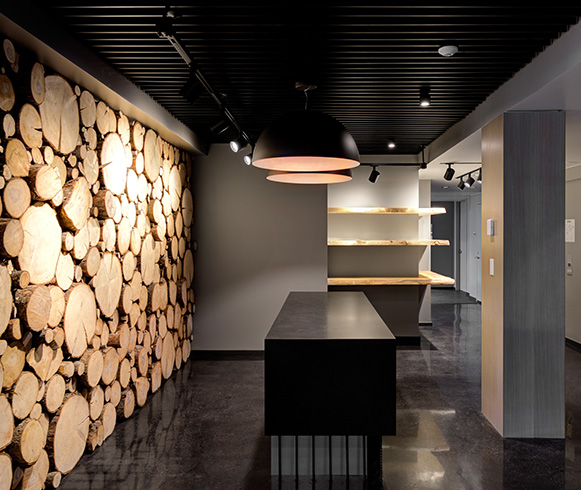 Office space with a natural wood finish accent wall.
