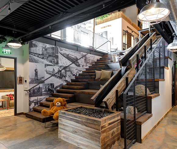 An open staircase within Kodiak Cakes open floor plan.