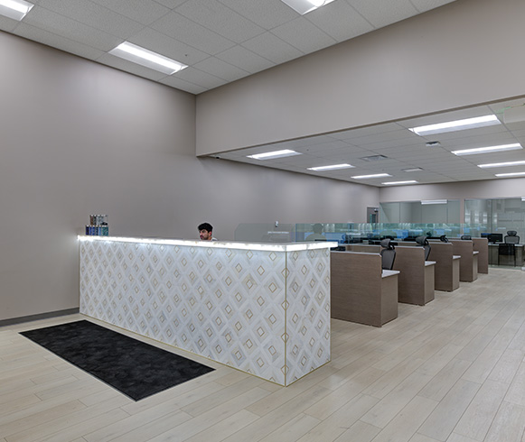 Reception area with a large white reception desk.