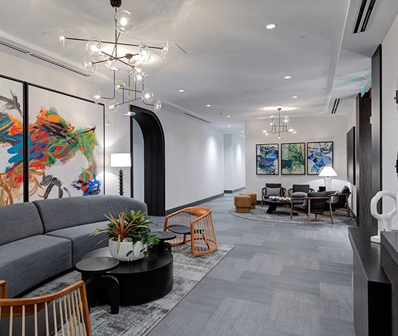 An open area with a couch and chairs for employees to use.