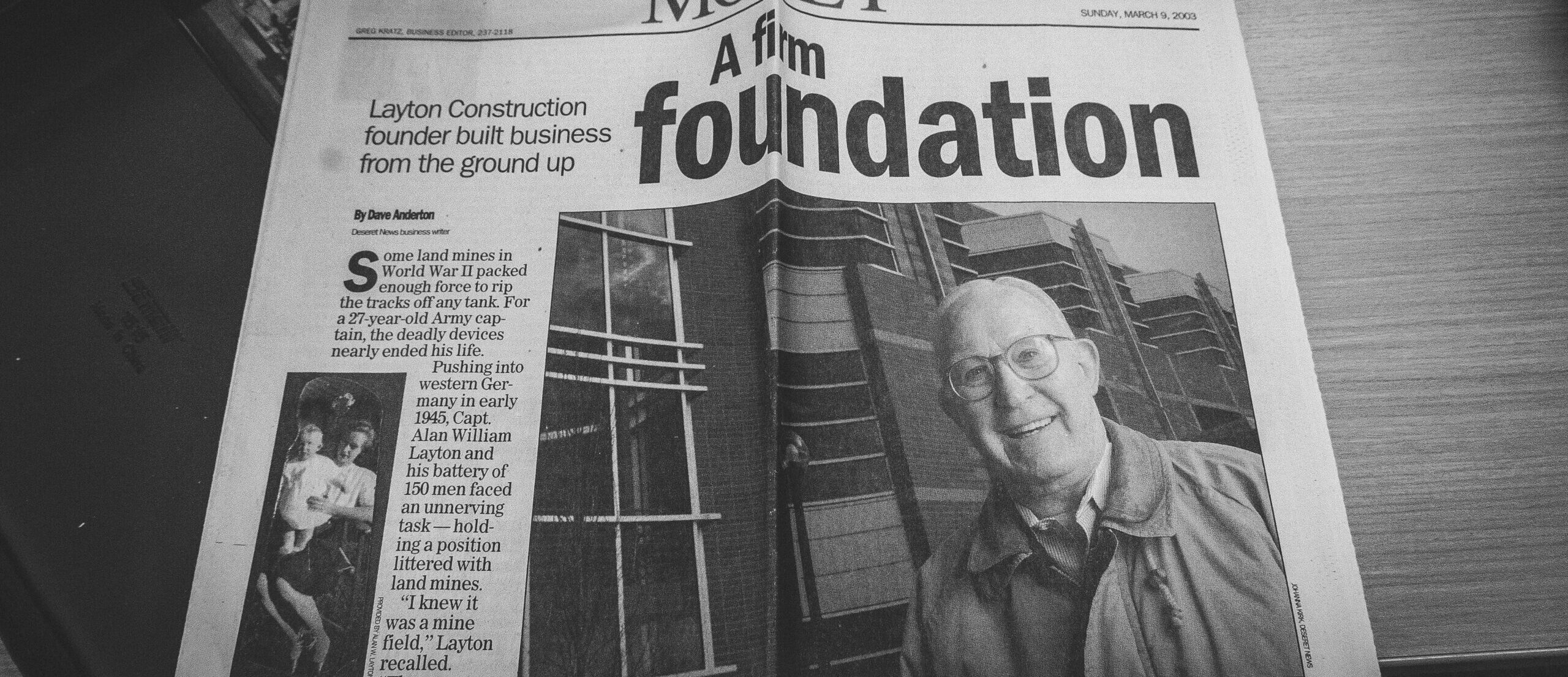 Front page of Desert News sharing how Layton Construction was founded and built from the ground up.