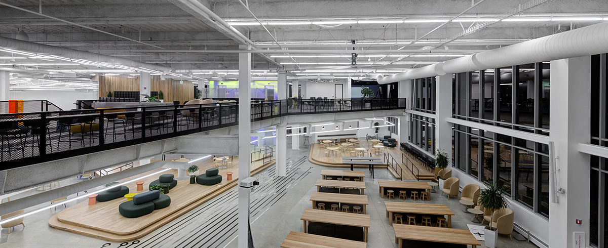 A birdseye interior view of Pluralsight's office space overlooking the downstairs space.