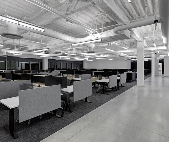 An open office space with cubicles throughout.