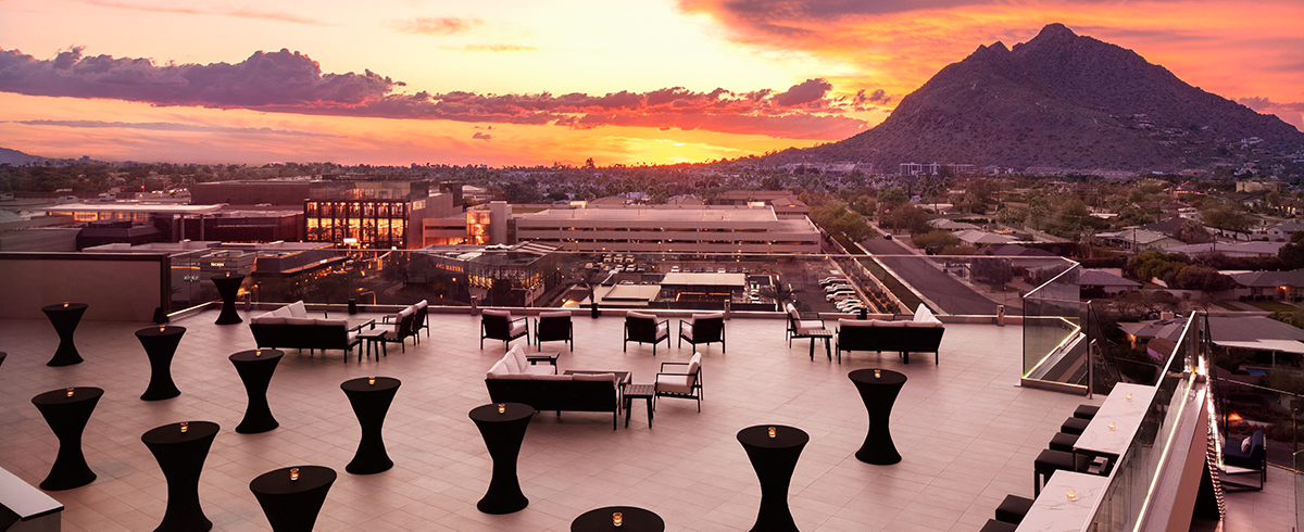 Exterior photo of Caesars Republic hotel showing the rooftop bar at sunset.