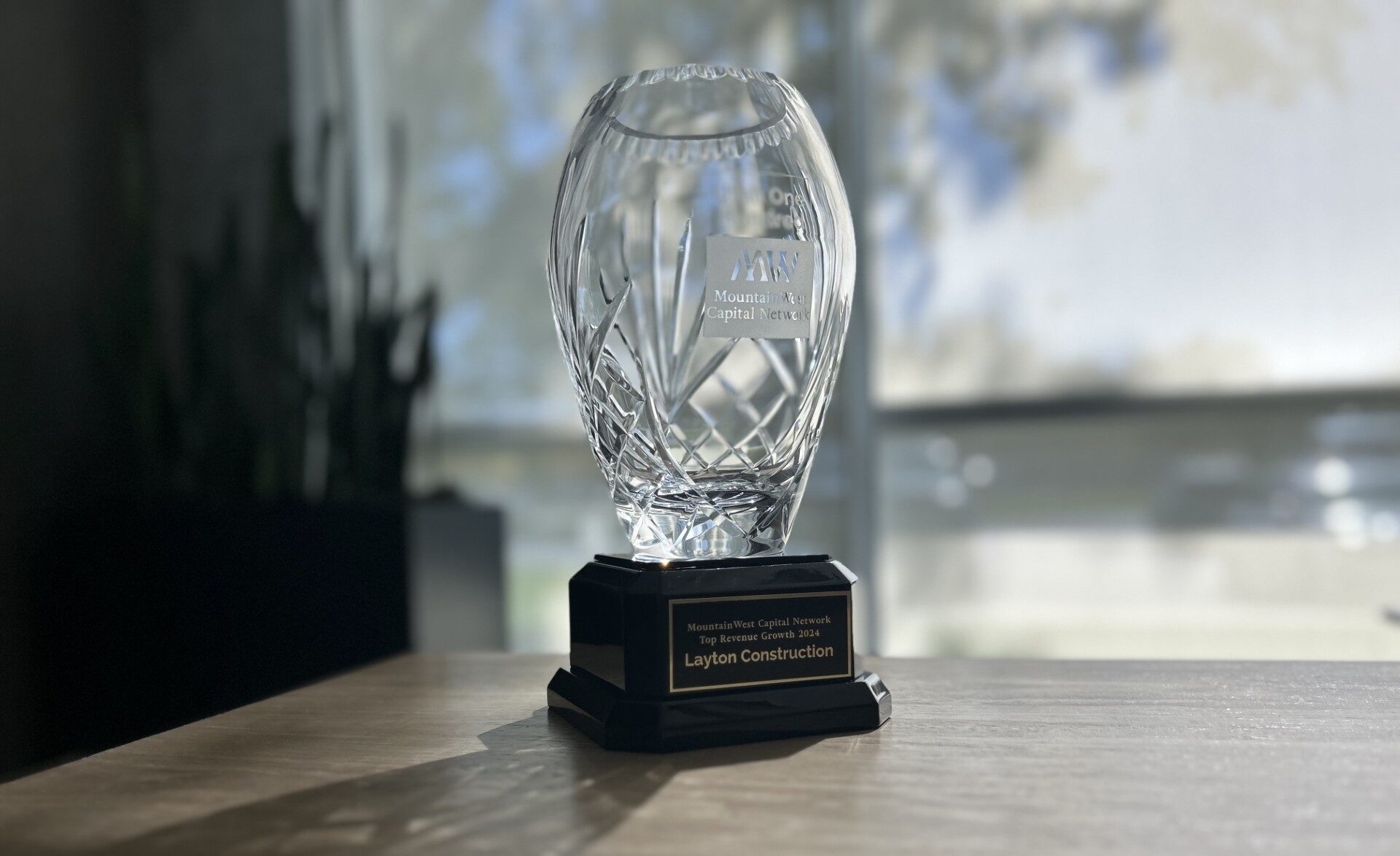 MountainWest Capital Network's Utah 100 trophy.