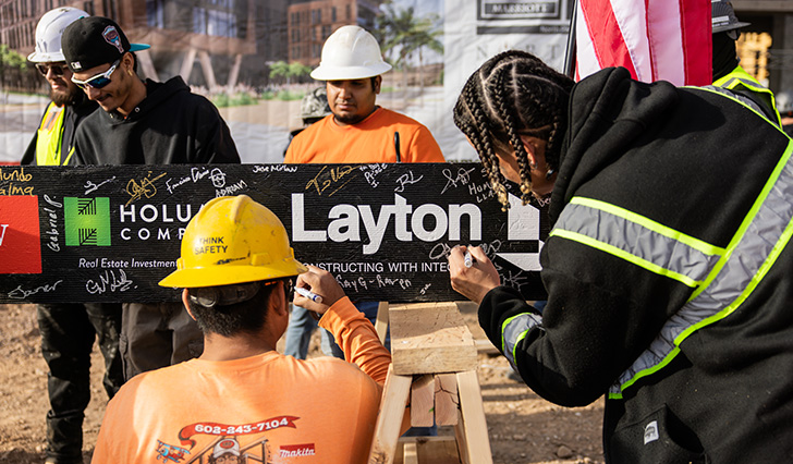 People signing beam at Westin at Noterra Topping Out in Phoenix