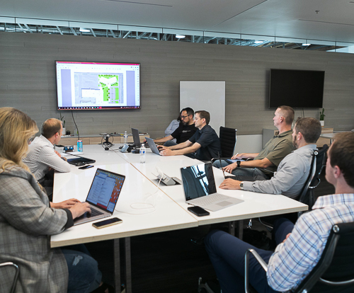 Design-build collaboration meeting between architect and contractor