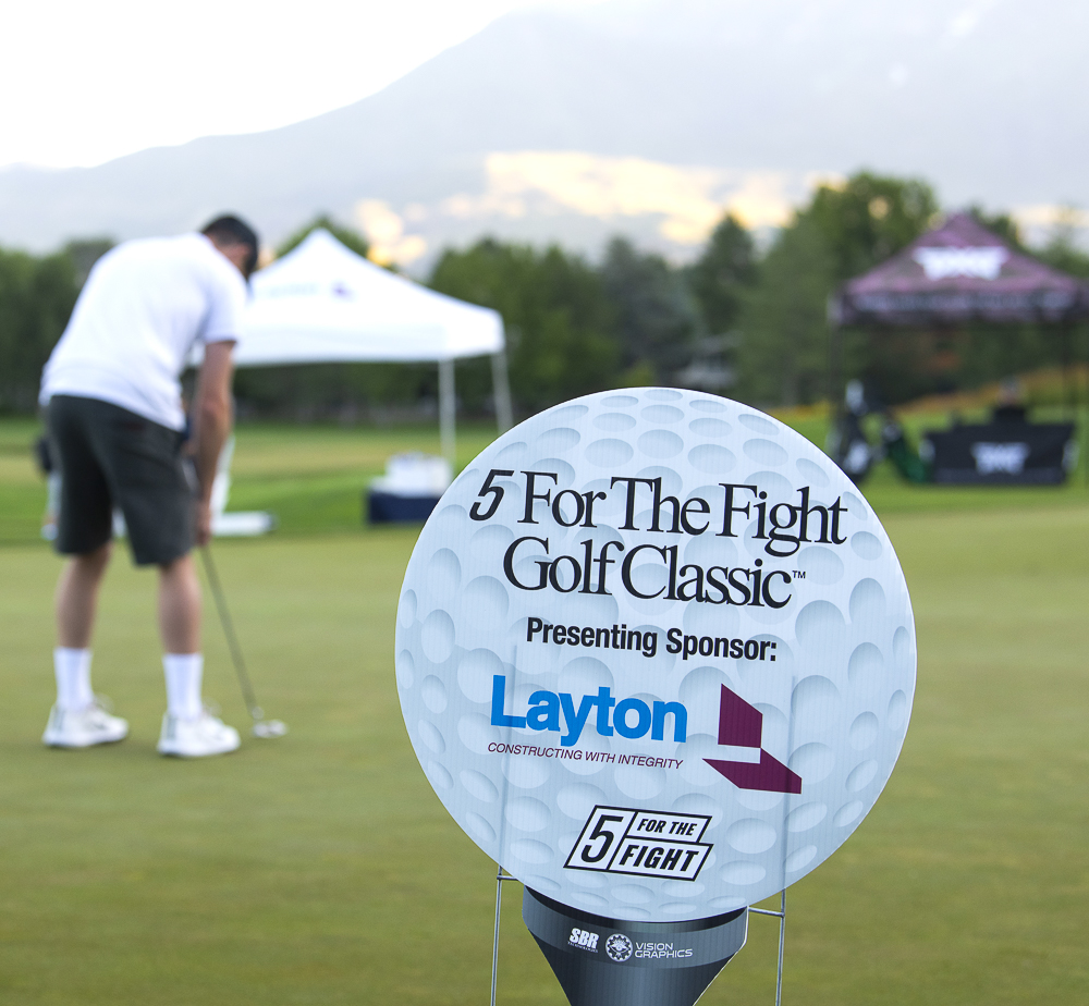 Tee box sponsor sign for a 5 For the Fight golf tournament