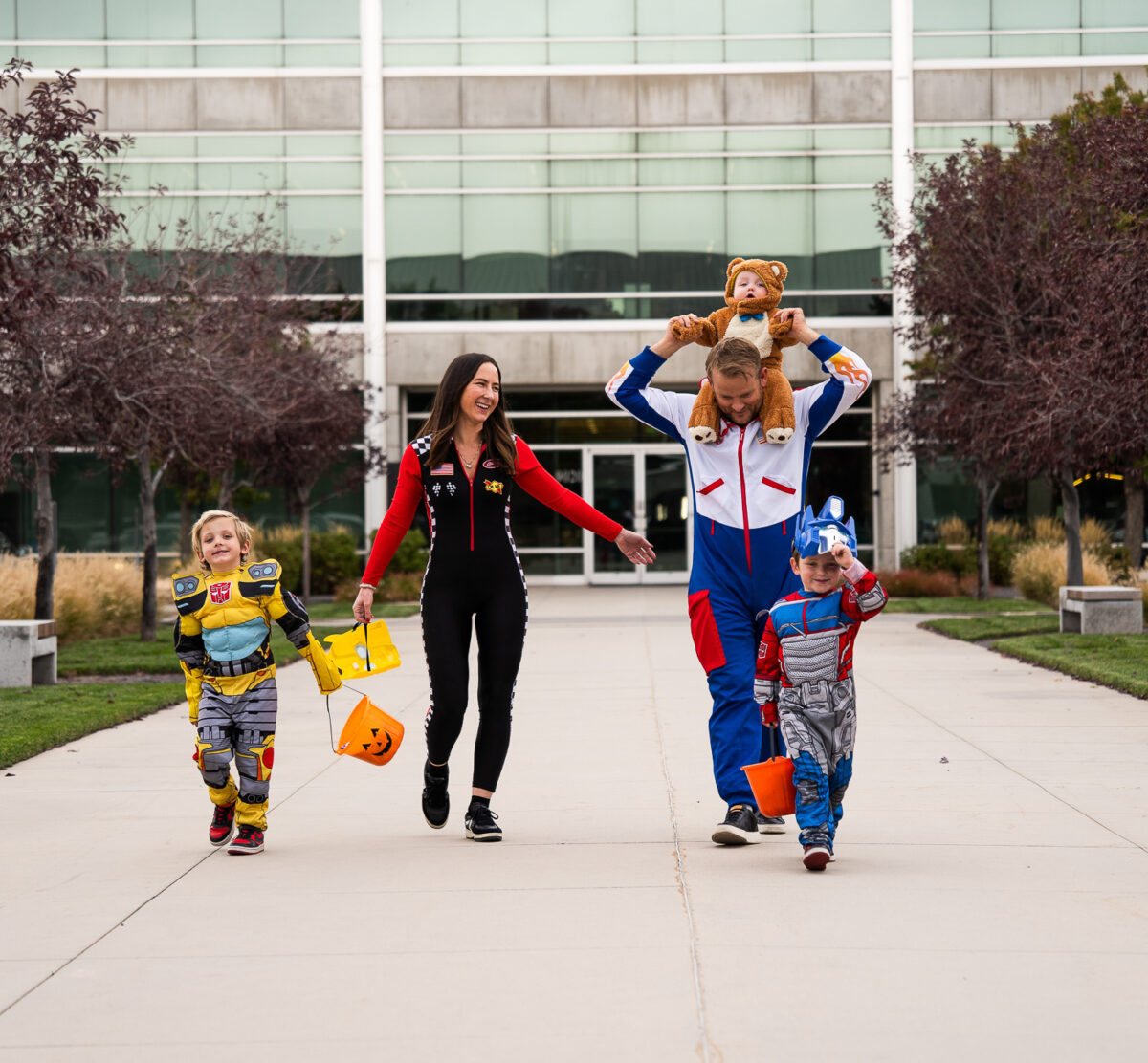 A family celebrating the office trick-or-treat event