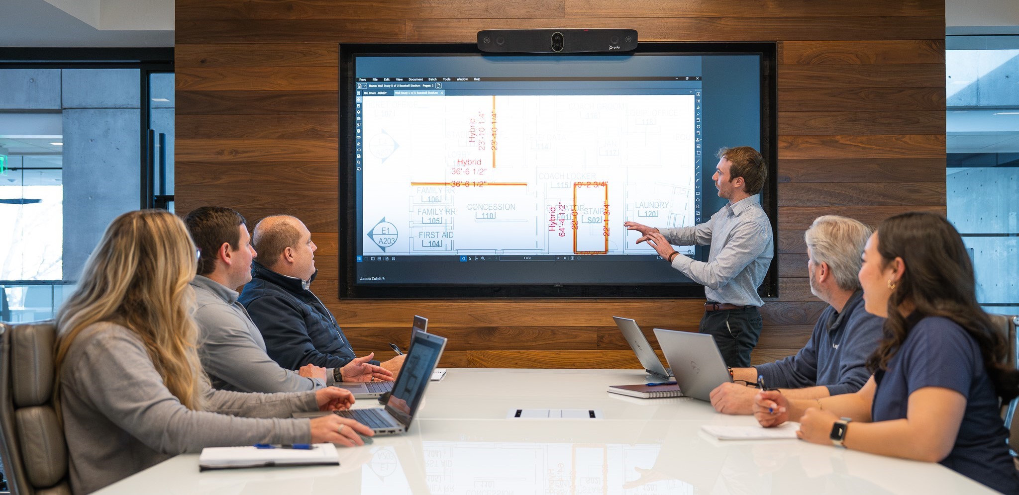 An estimating team collaborating with a screen showing a take-off.