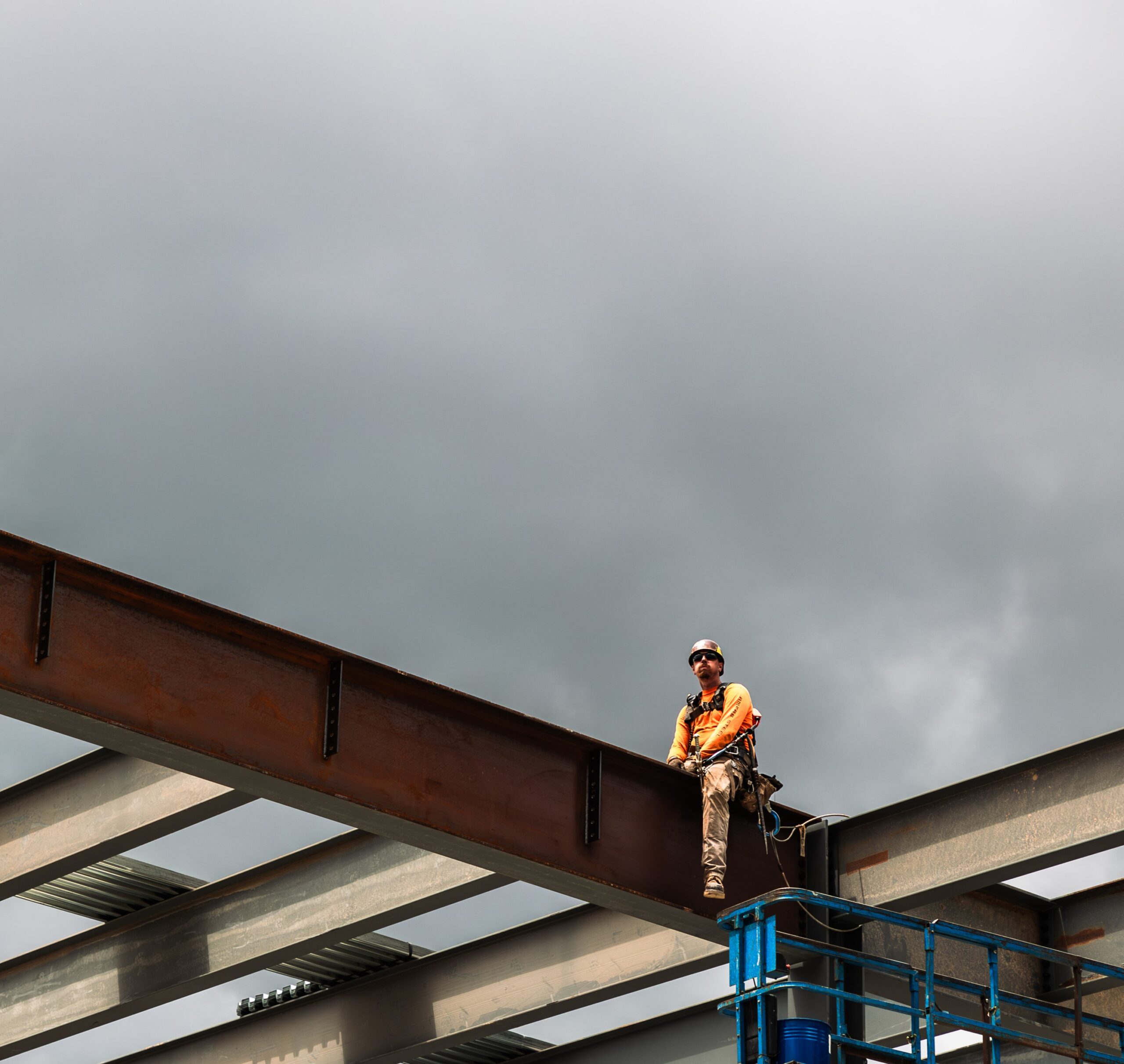 Iron worker tied off on steel structure