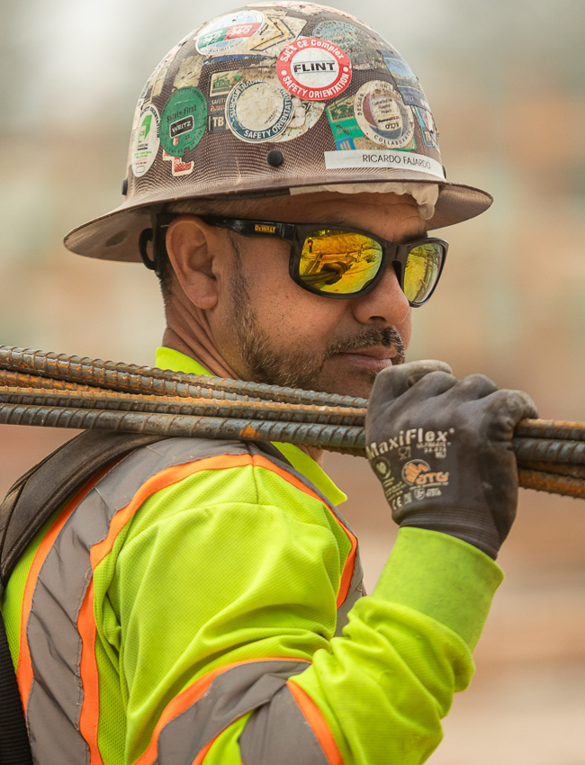 A trade partner carrying rebar on a site in Calistoga, CA
