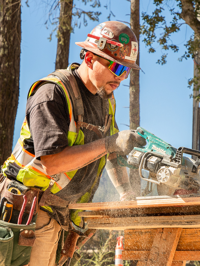 A trade partner using a table saw on a site in Calistoga, CA