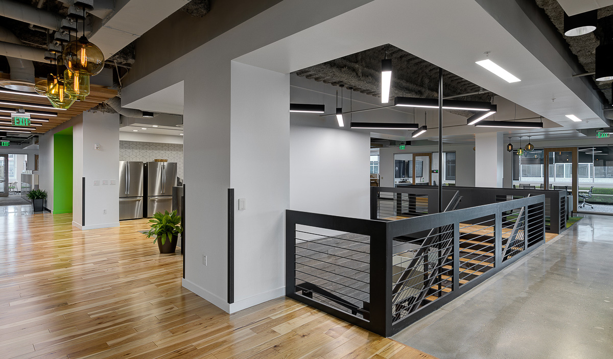 A central staircase in Extra Space Storage's open floor plan.