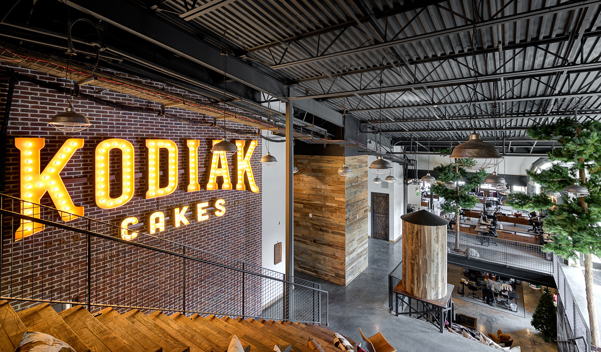 Open staircase spanning three floors in Kodiak Cakes office.