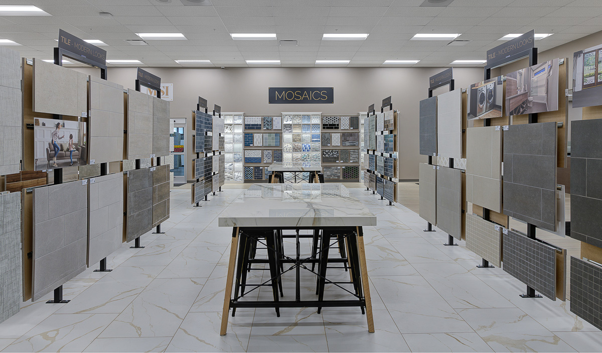 A tile store with several different options hanging throughout the store.