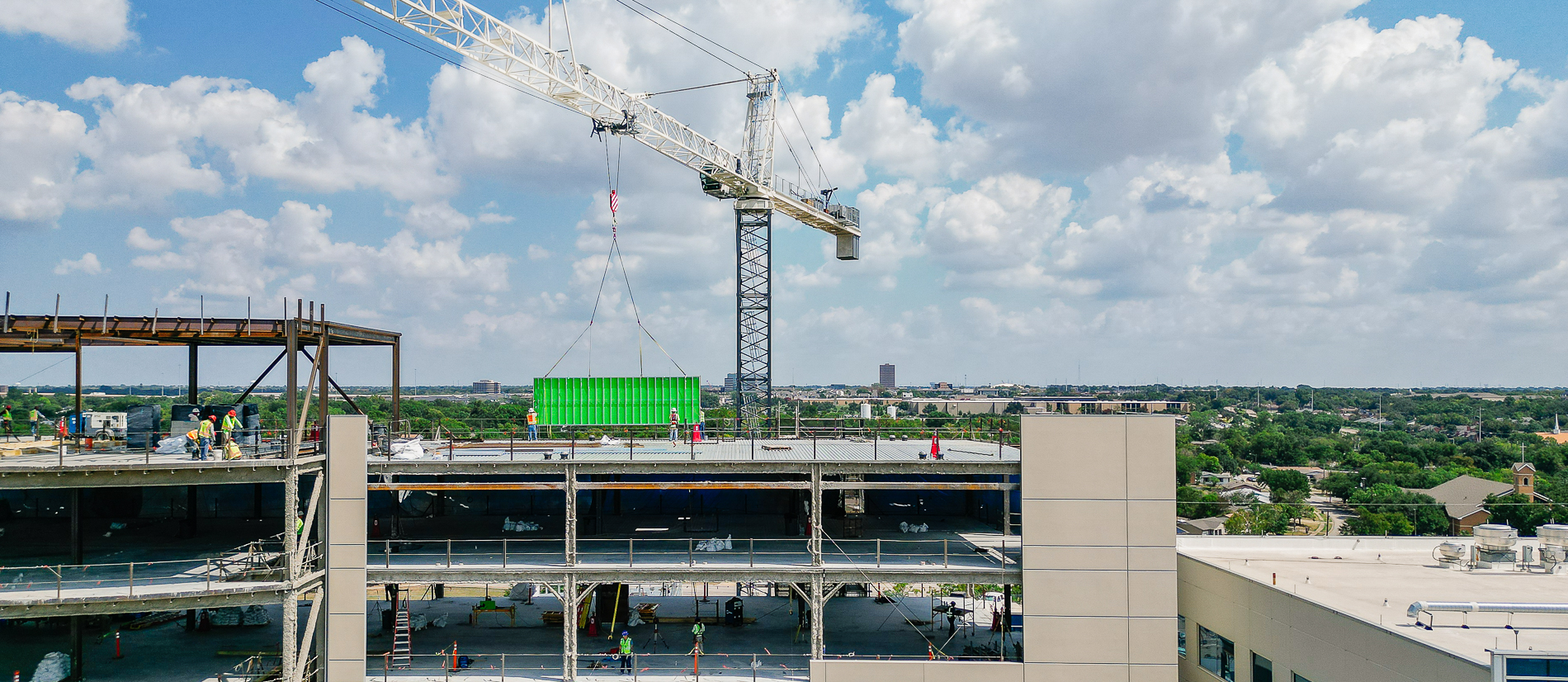 Installation of prefabricated exterior panel on hospital in Dallas