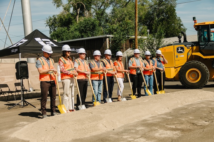 South Salt Lake officials and project personnel at the groundbreaking ceremony for the new Public Works Campus, holding shovels on the construction site.