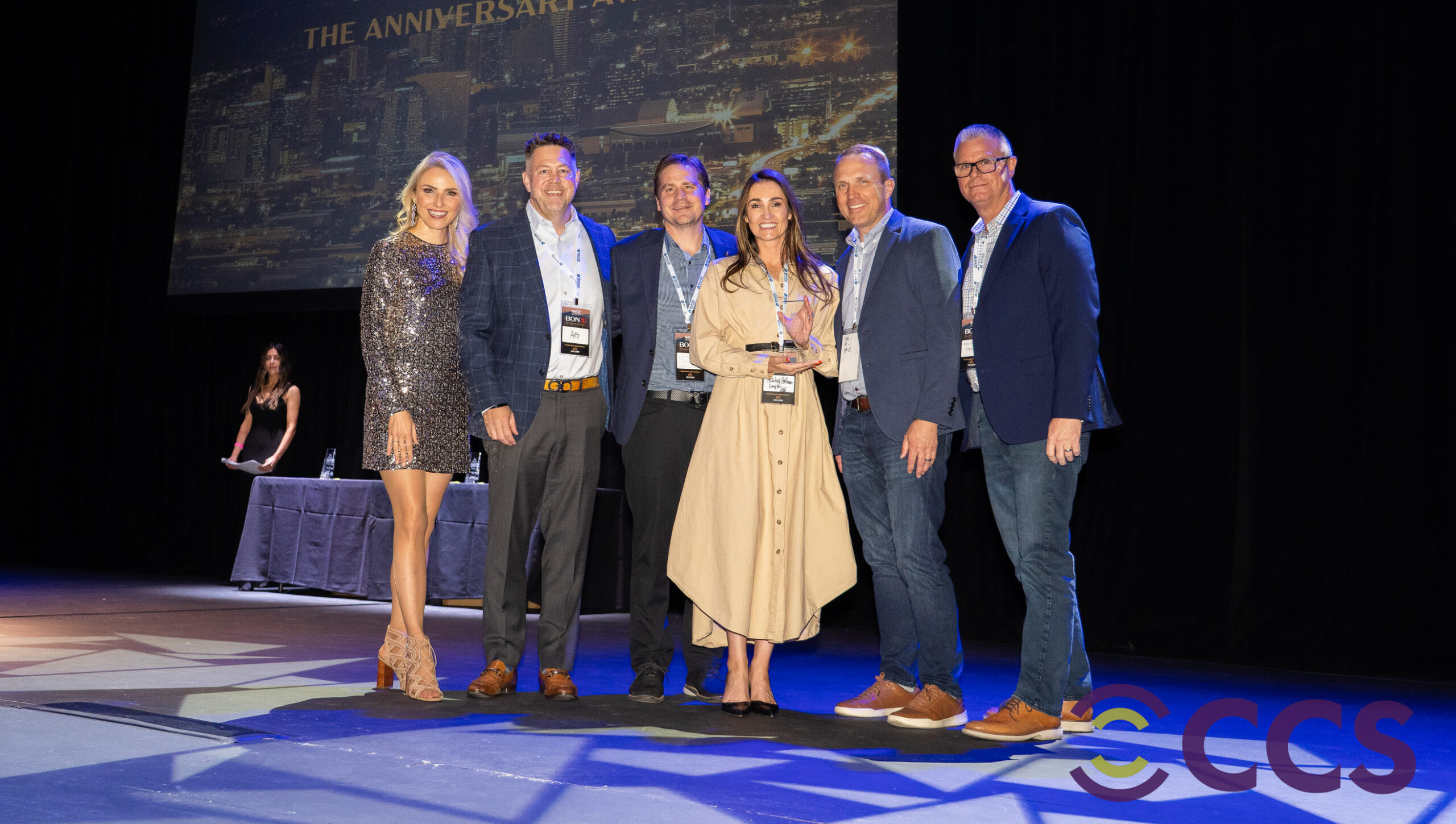 Layton Arizona team hold General Contractor of the Year award on stage at NAIOP awards. p-hero-w-heading__img